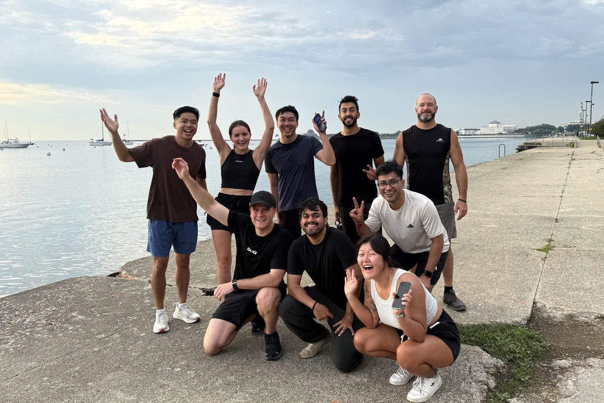 The running crew cheering on the Lake Michigan shoreline