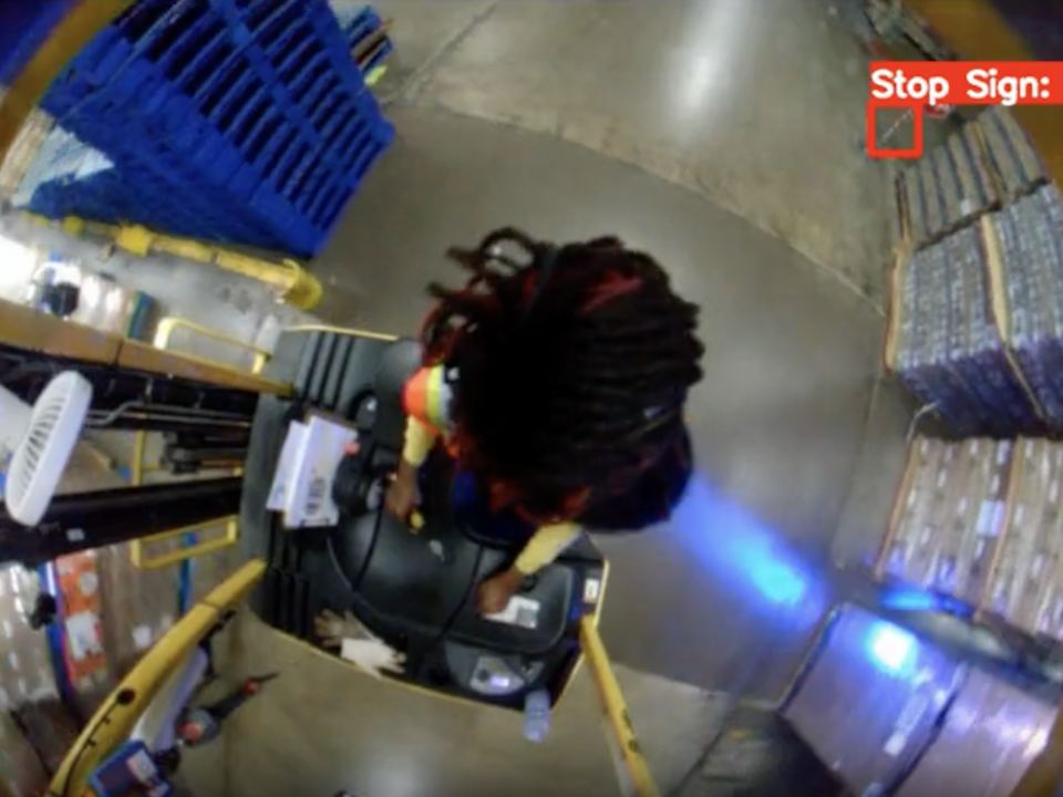 Overhead view of a lift passing a stop sign the camera has detected