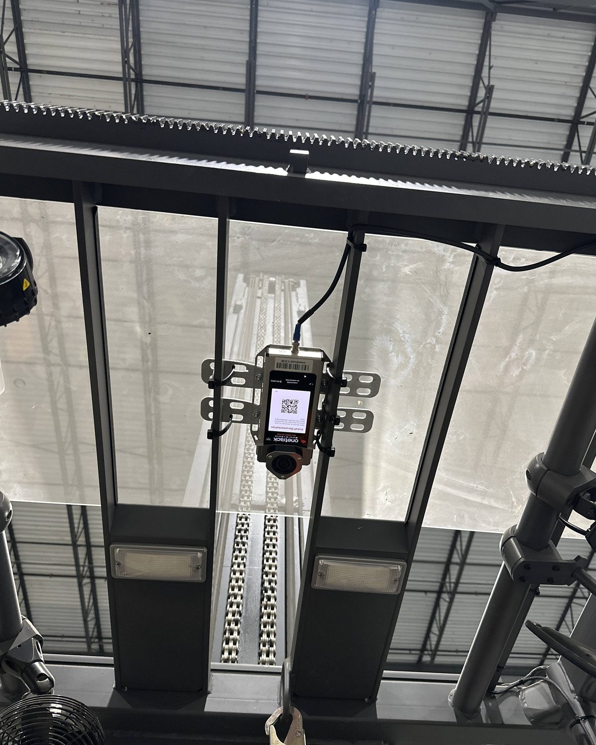 A OneTrack sensor mounted inside the cab of a turret truck